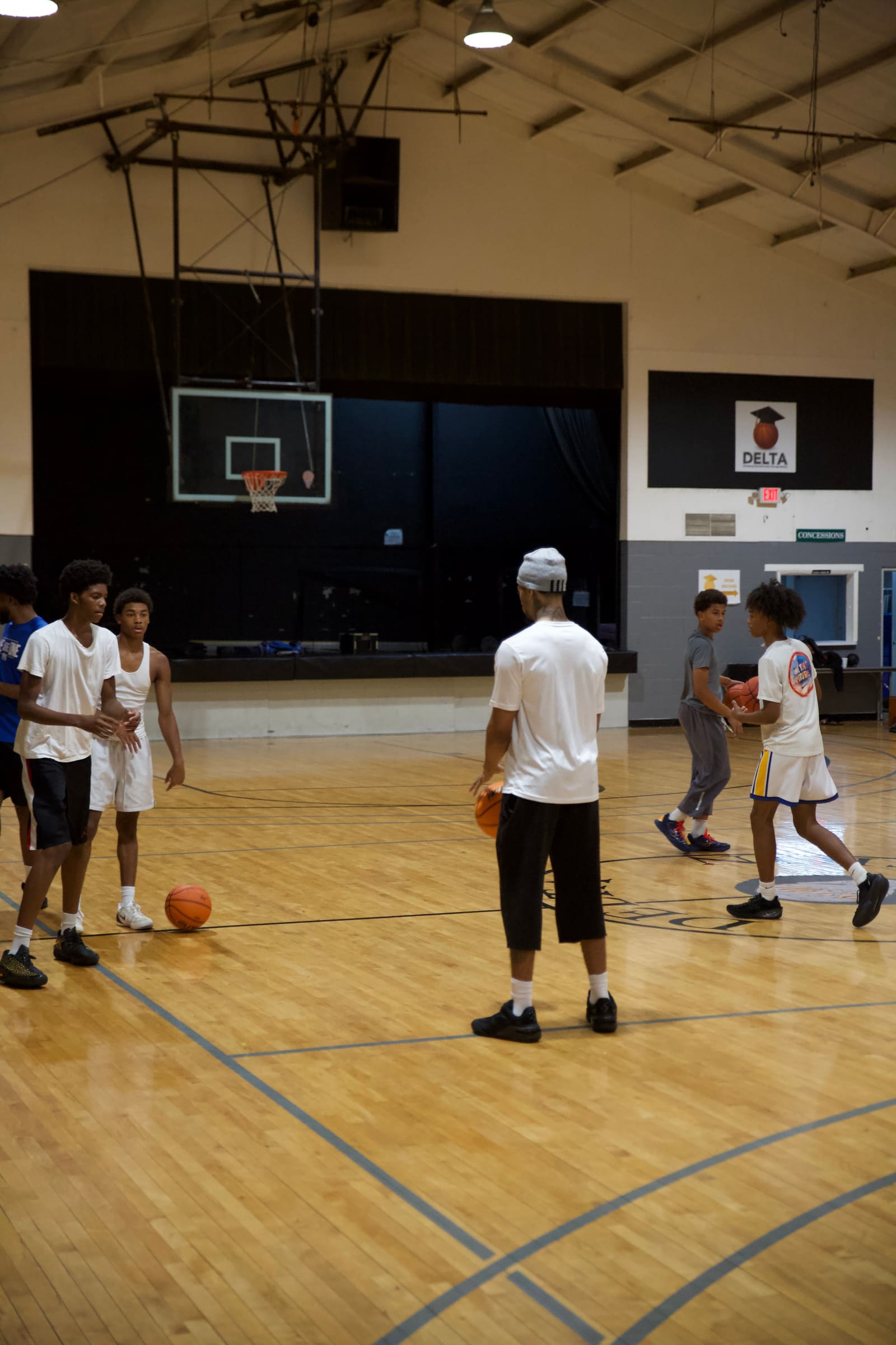 Basketball players in a court action scene