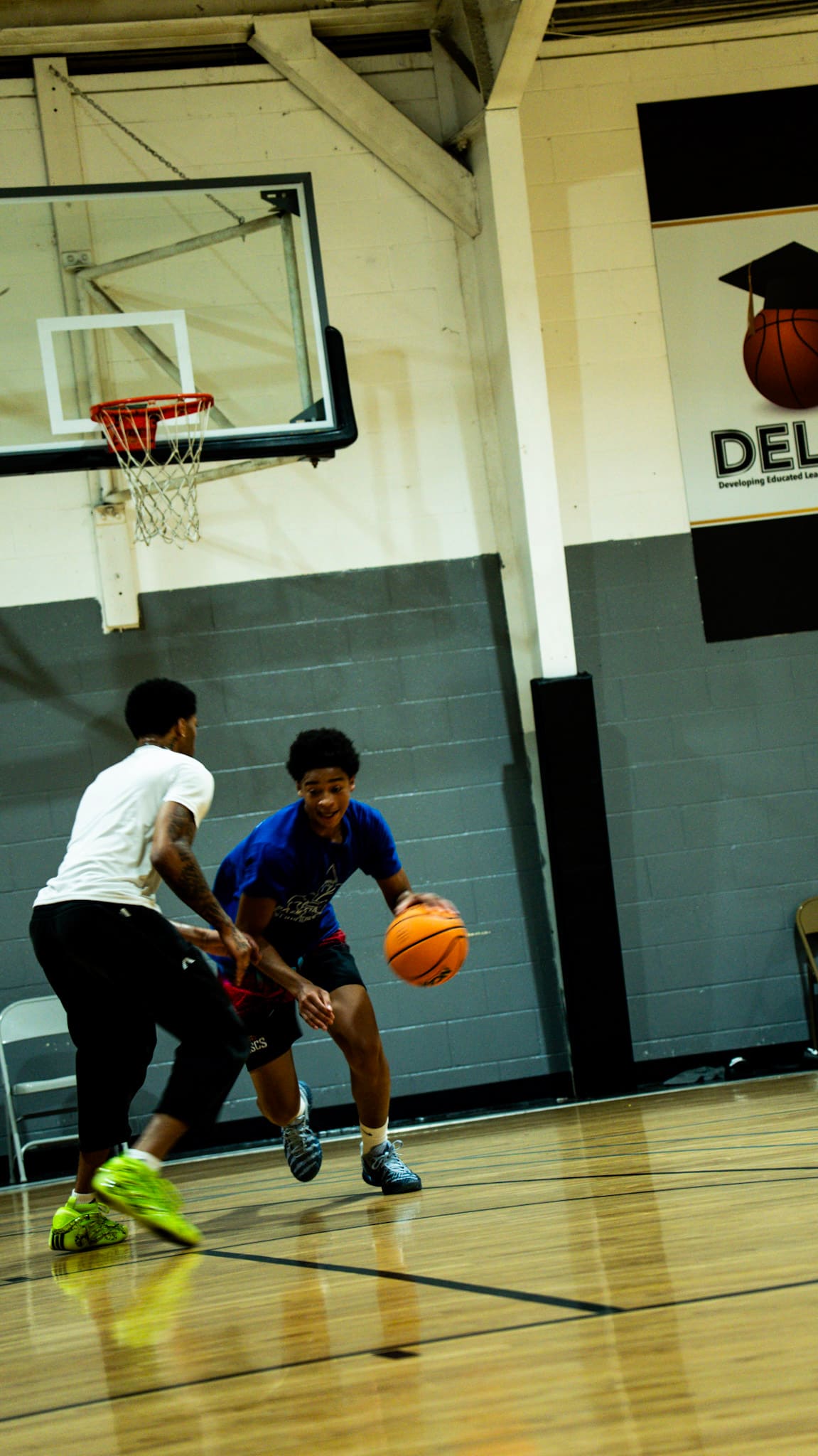 Basketball player driving under the basket