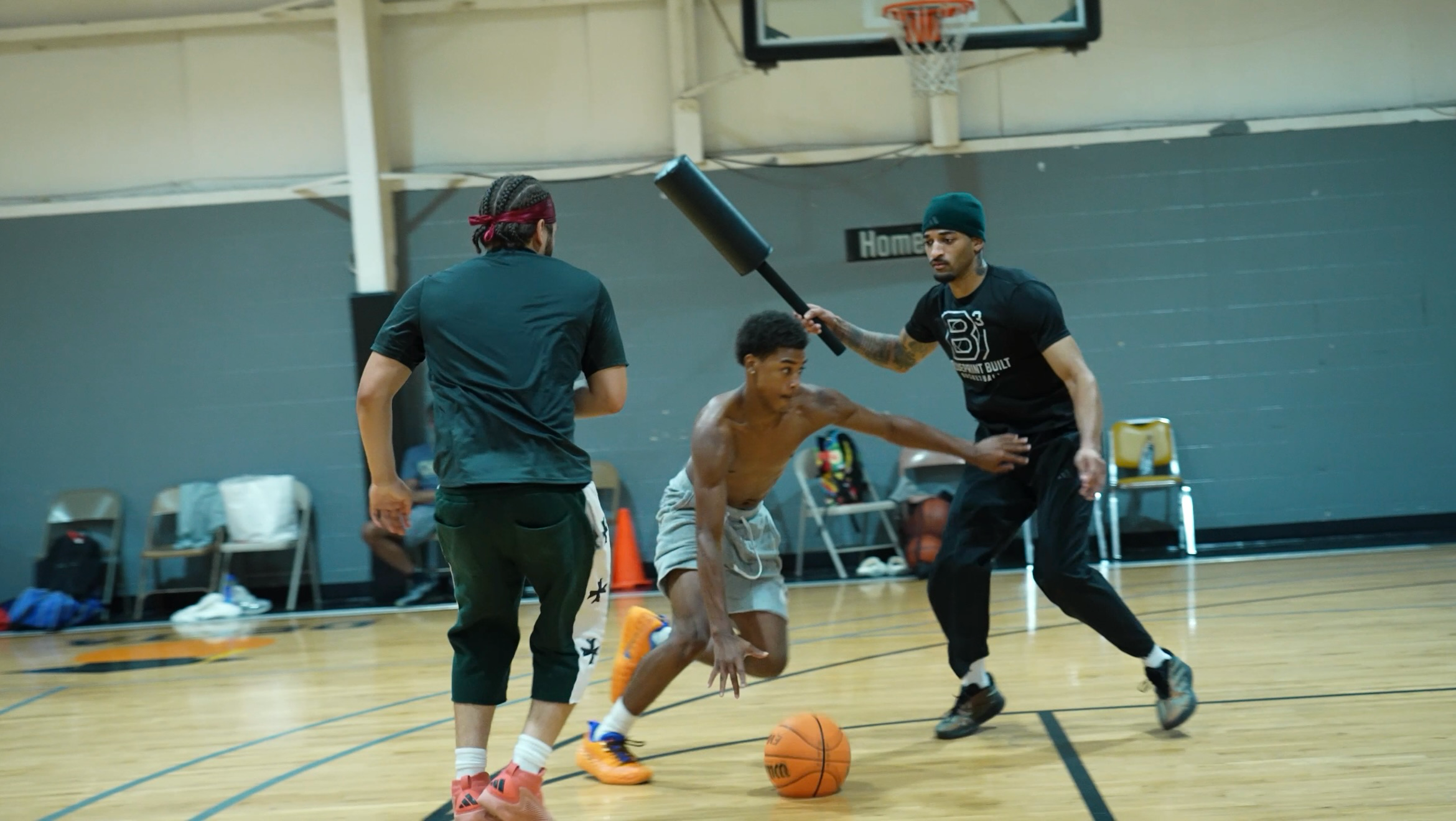 Basketball player driving through a training exercise